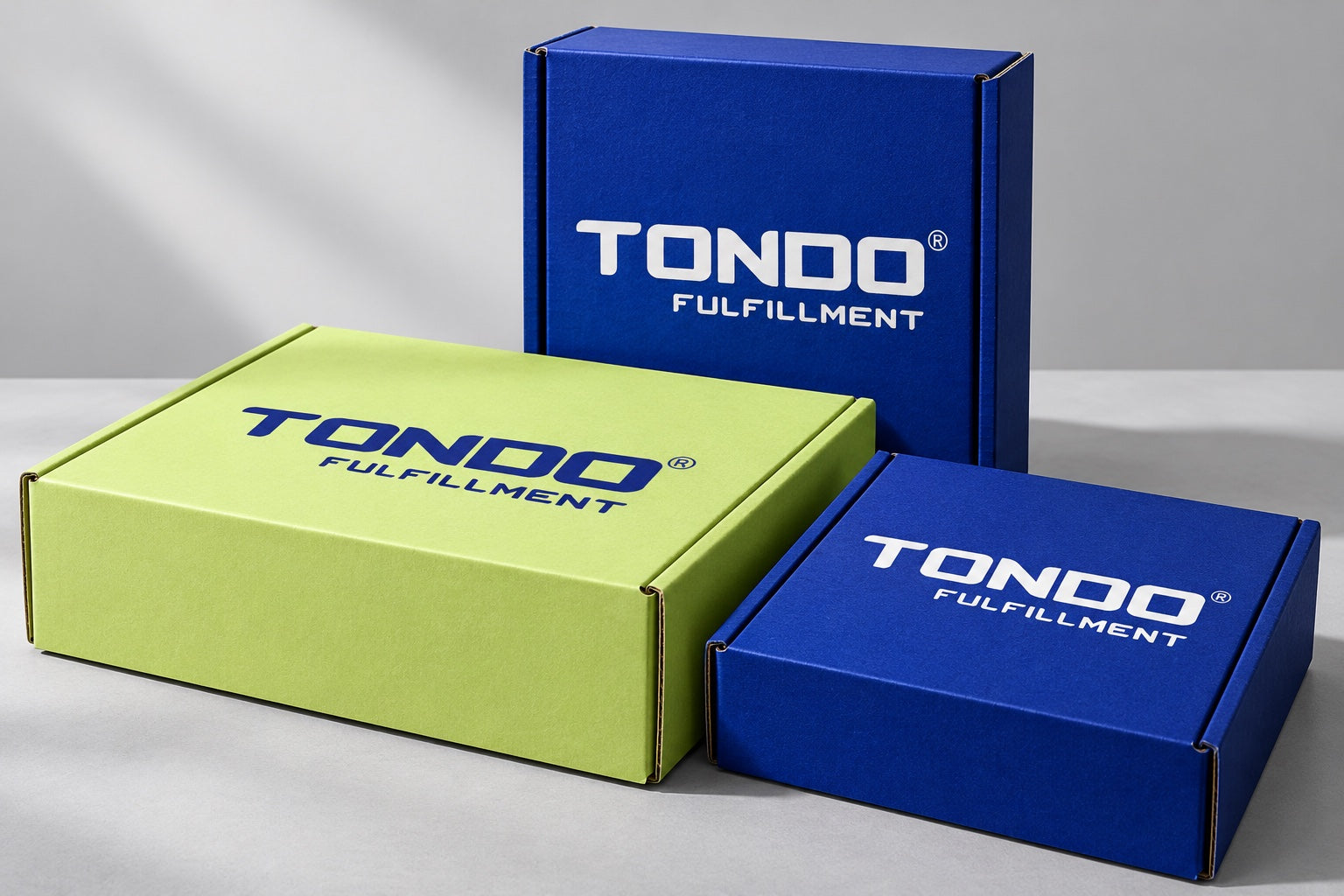 Three closed Tondo branded mailer boxes in different sizes